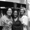 Three women stand together