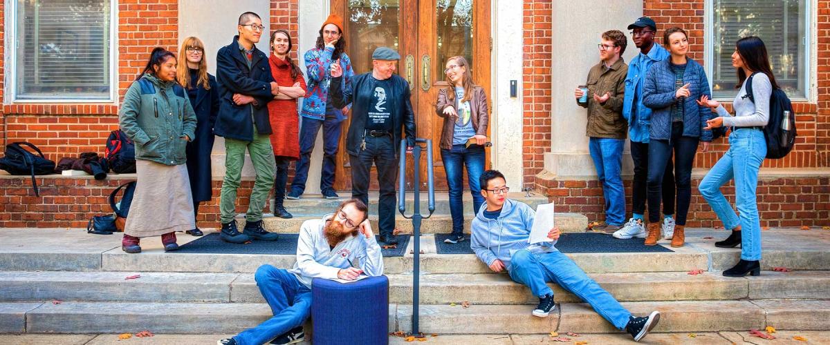 Philosophy Students posing on the steps of the Philosophy Department building