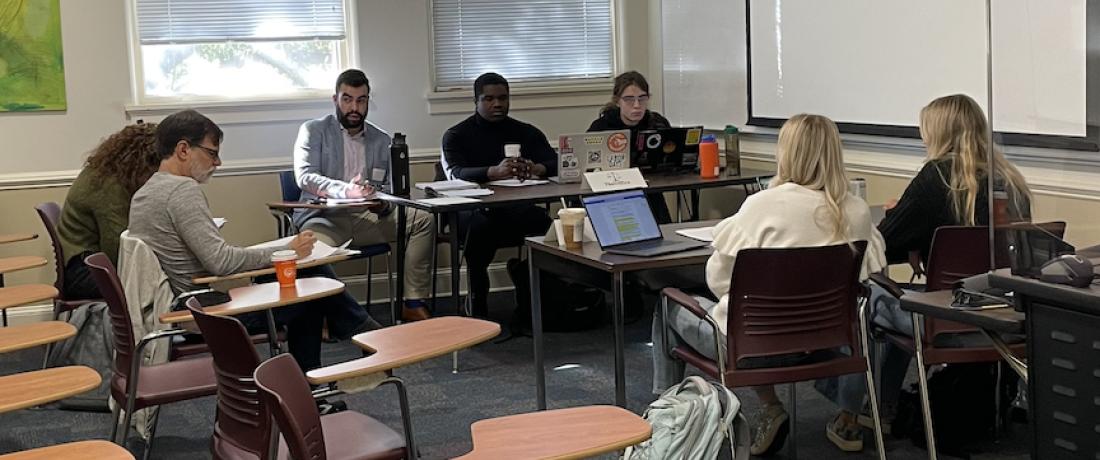 Ethics Bowl '22 - Lucas Deibert, Stephen Black, and Pandora Paterson (The Office) face off against Ridley White and Rachel Dahmer (Ridley & Rachel) during the first round as Kat O’Brien and Christian Turner judge. 